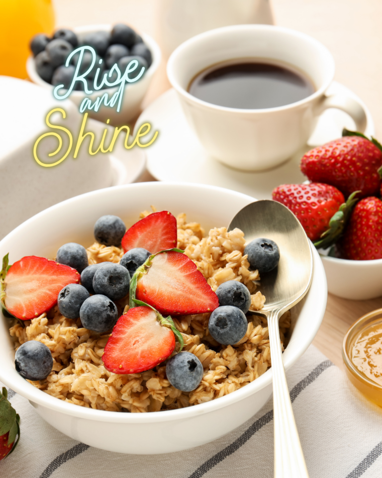 a bowl of cereal topped with fruit beside a cup of black coffee