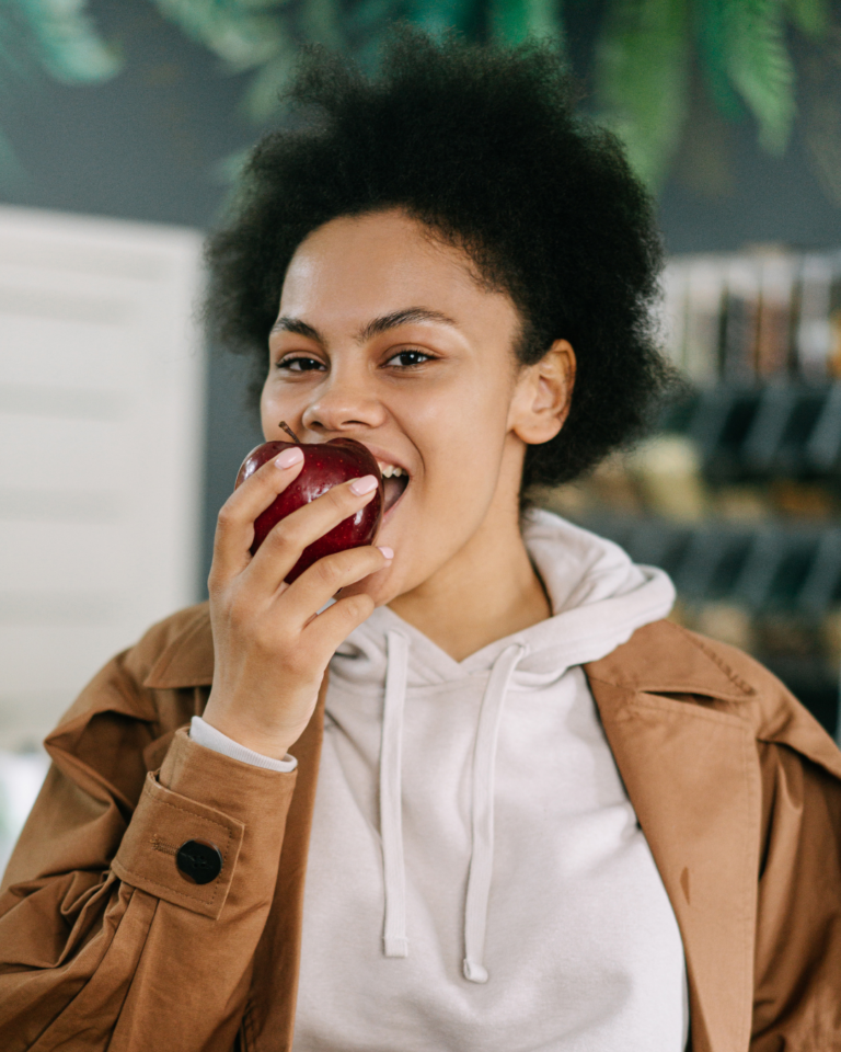 a woman eating an apple